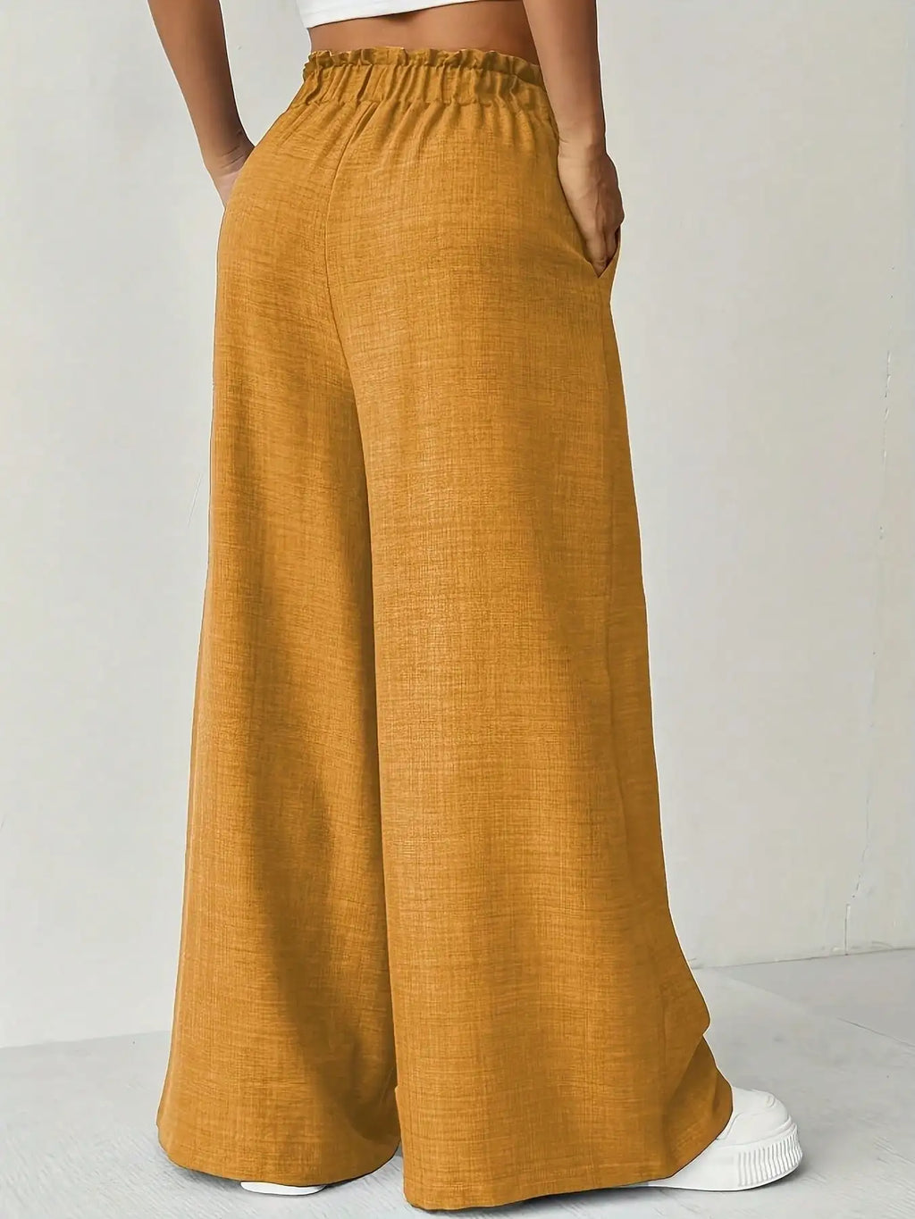 Pantalón ancho de cintura alta con lazo