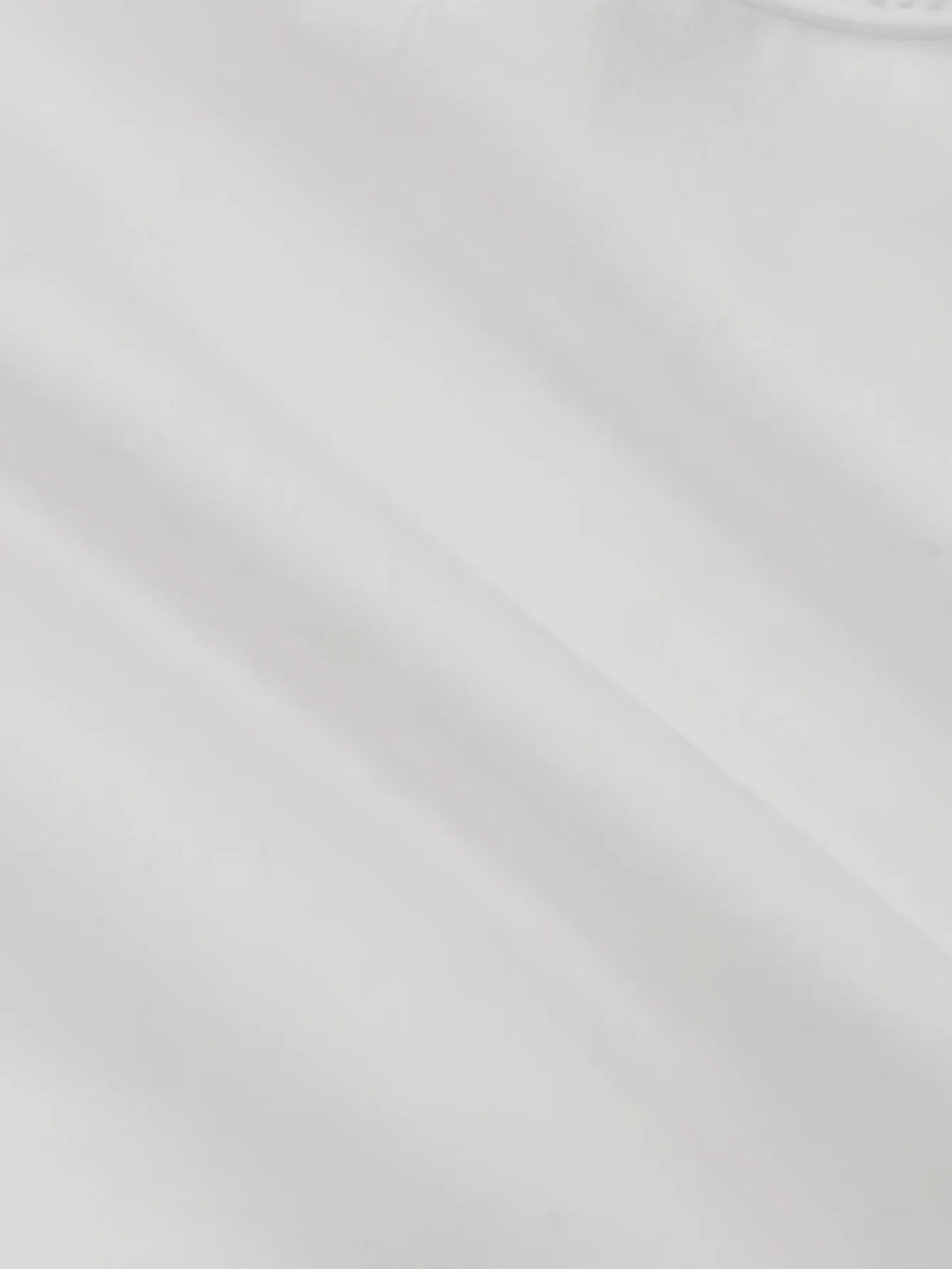 Top de manga larga con fruncido y abertura