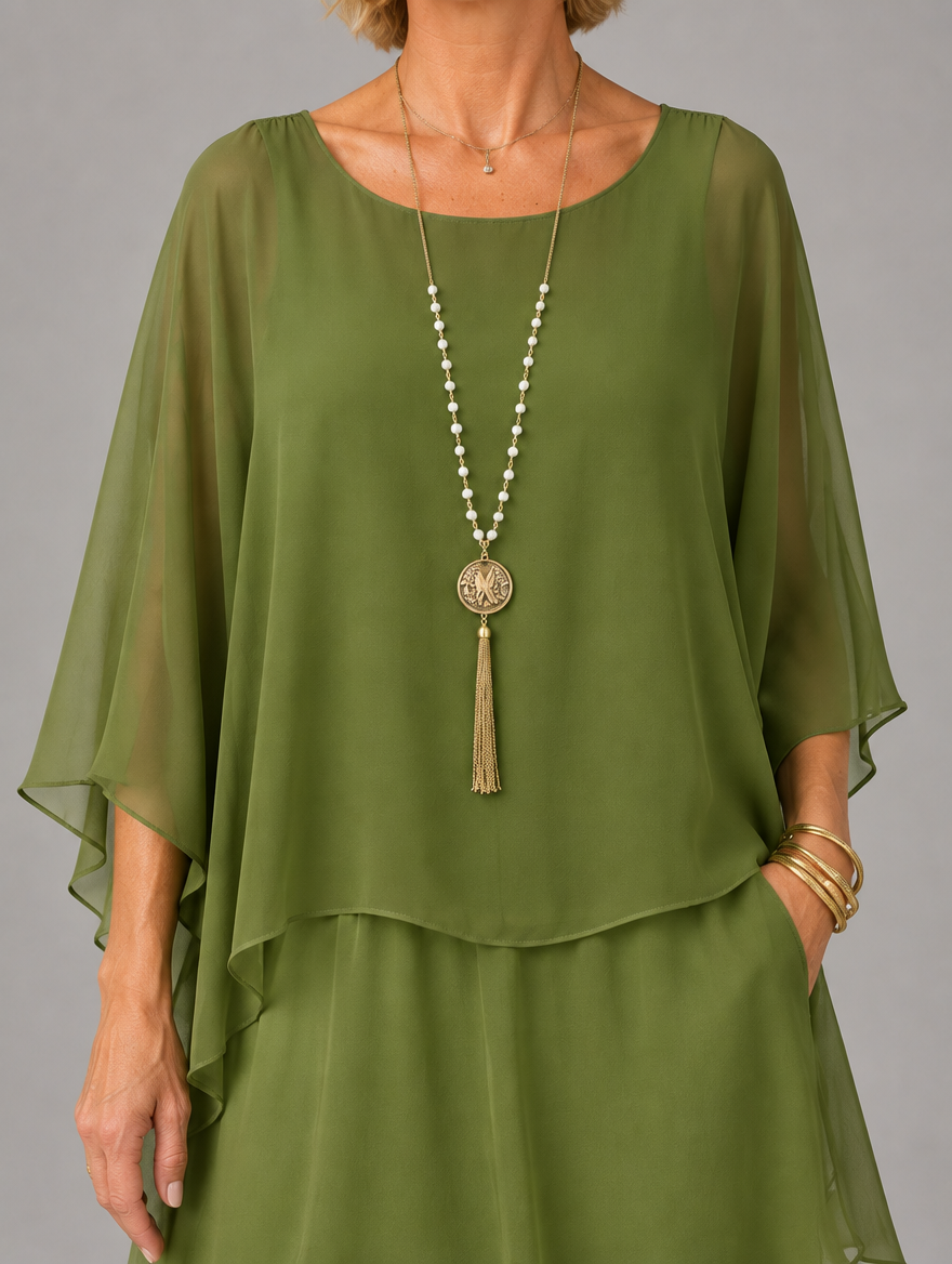 Vestido maxi con capa y falda de volantes