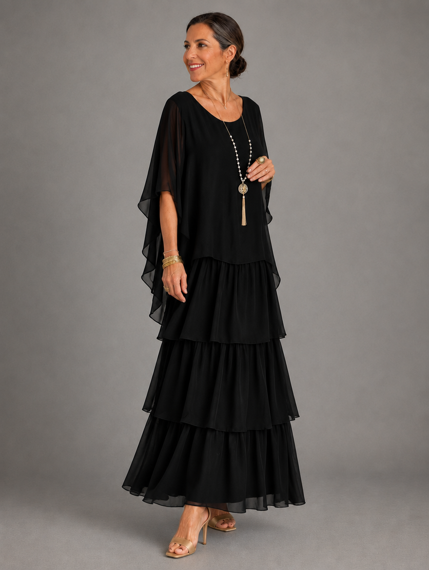 Vestido maxi con capa y falda de volantes