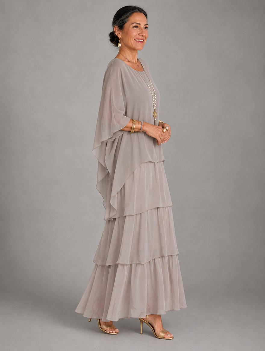 Vestido maxi con capa y falda de volantes