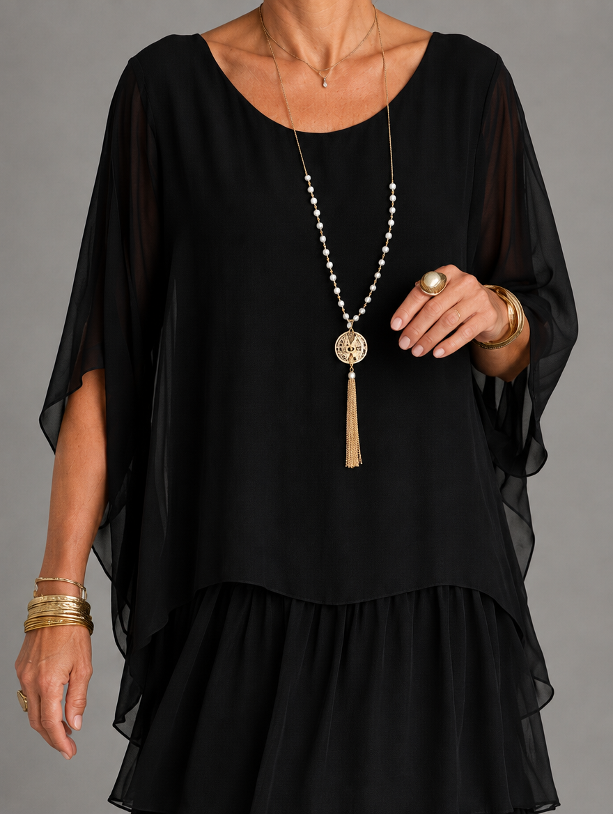 Vestido maxi con capa y falda de volantes