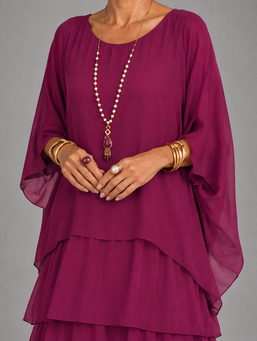 Vestido maxi con capa y falda de volantes