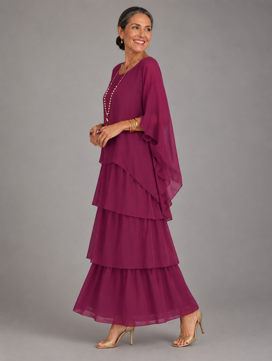 Vestido maxi con capa y falda de volantes