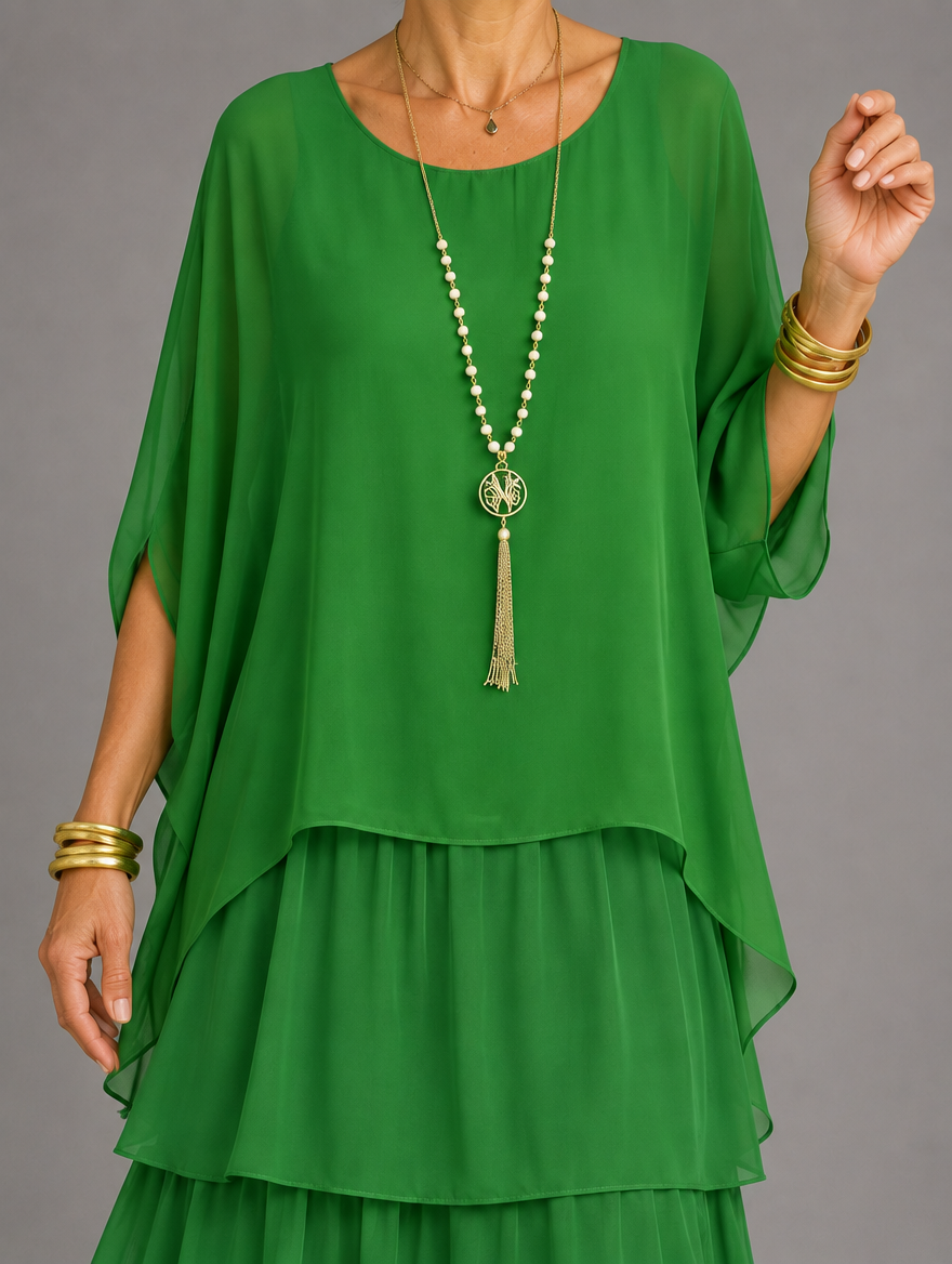 Vestido maxi con capa y falda de volantes