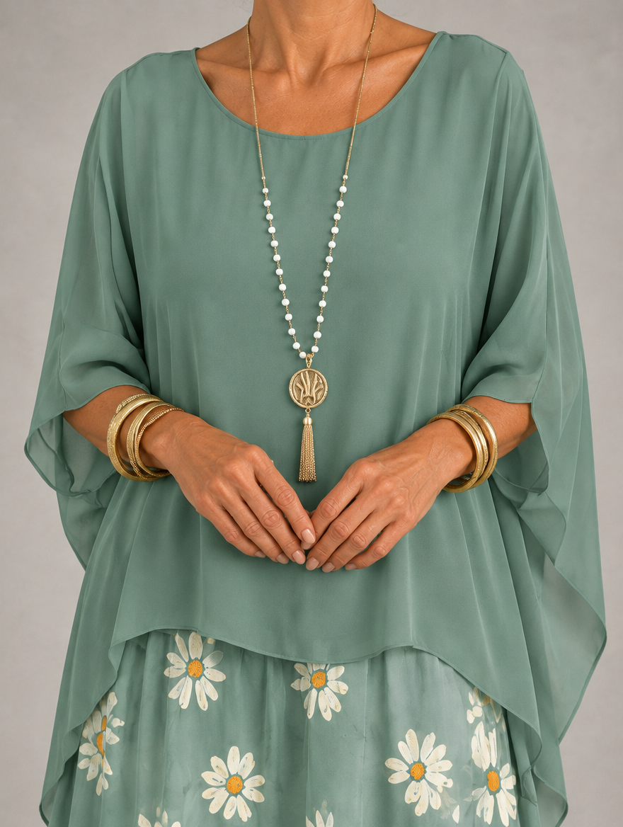 Vestido maxi con capa y falda de volantes
