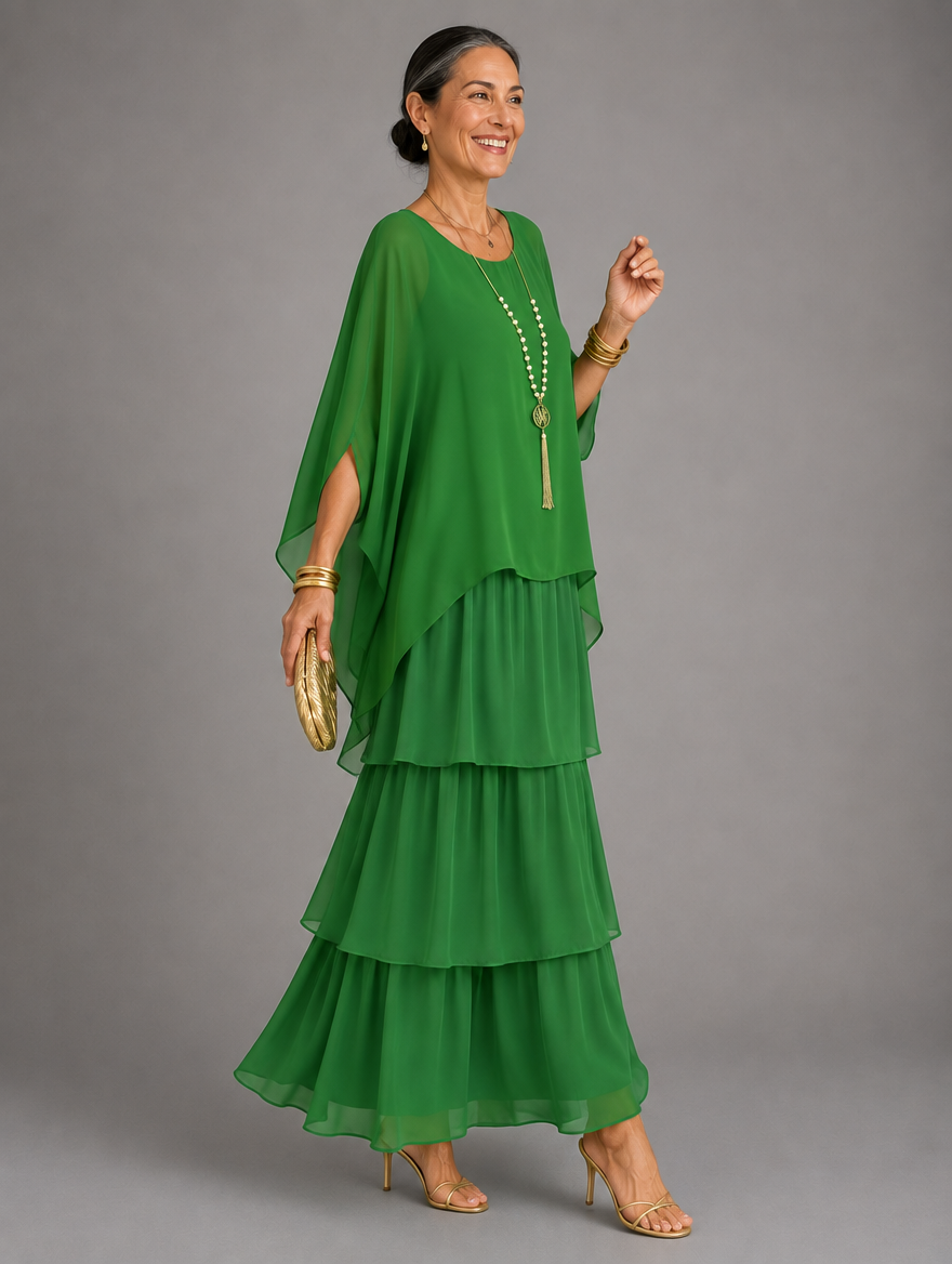 Vestido maxi con capa y falda de volantes