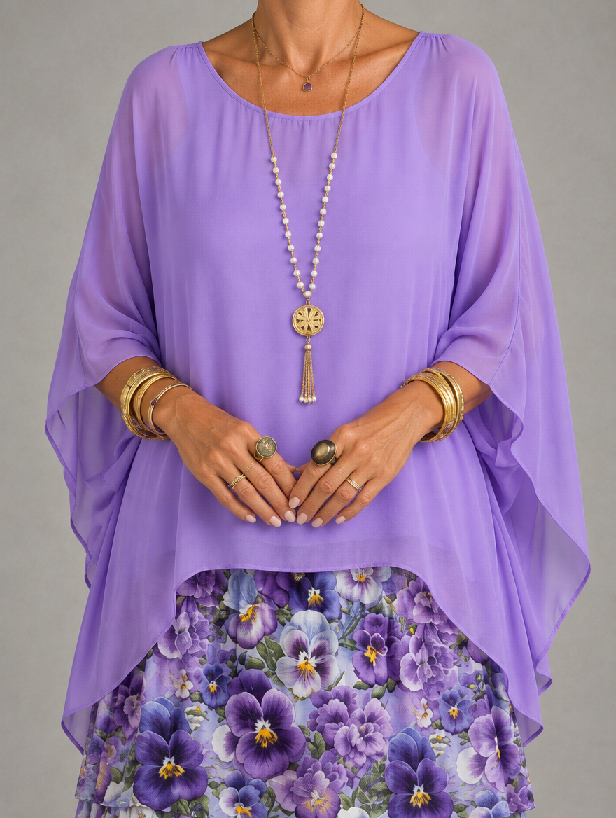 Vestido maxi con capa y falda de volantes
