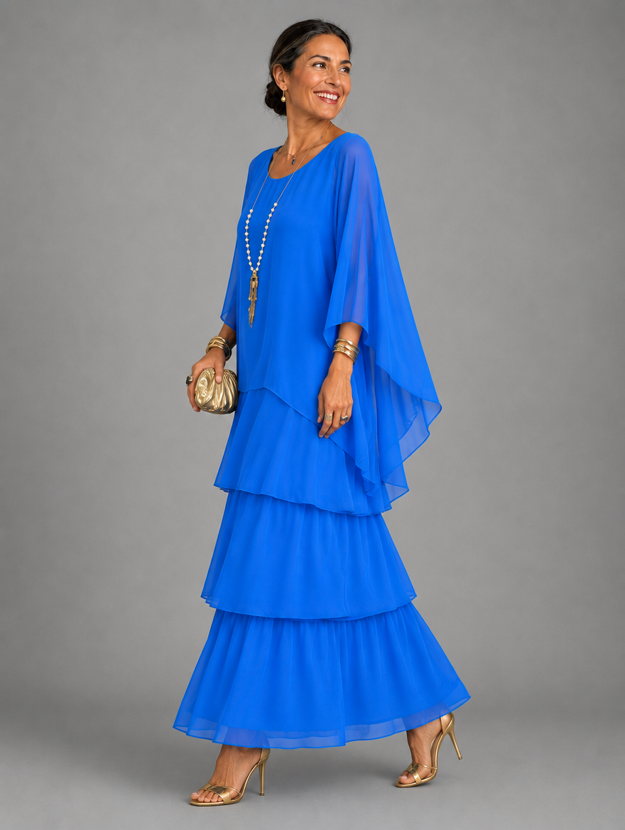 Vestido maxi con capa y falda de volantes