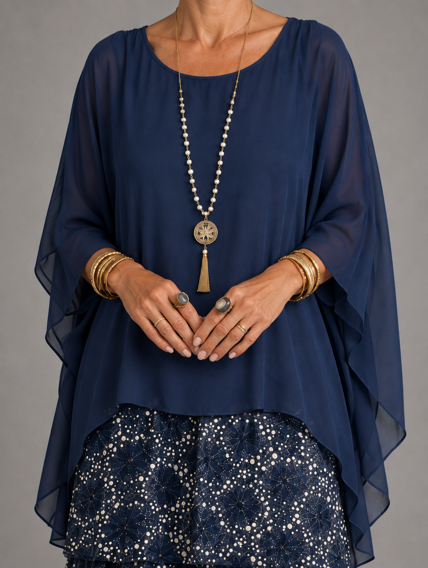 Vestido maxi con capa y falda de volantes